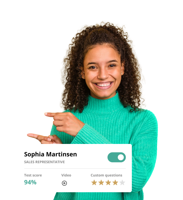 Woman in green turtleneck with Test score card